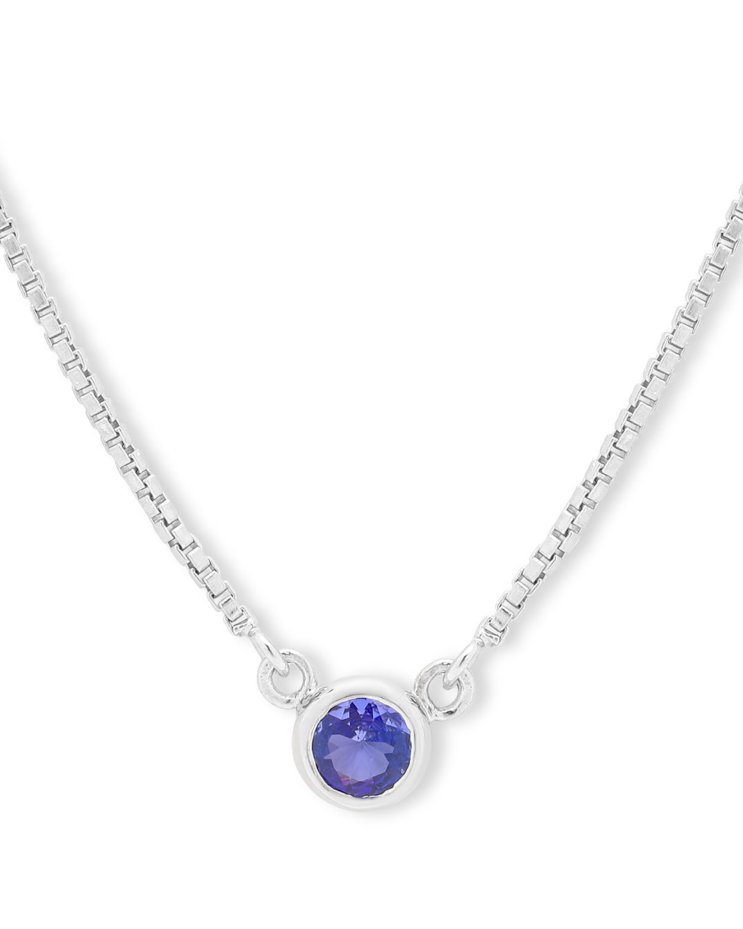 Timeless solitaire pendant with a round-cut gemstone in a prong setting.