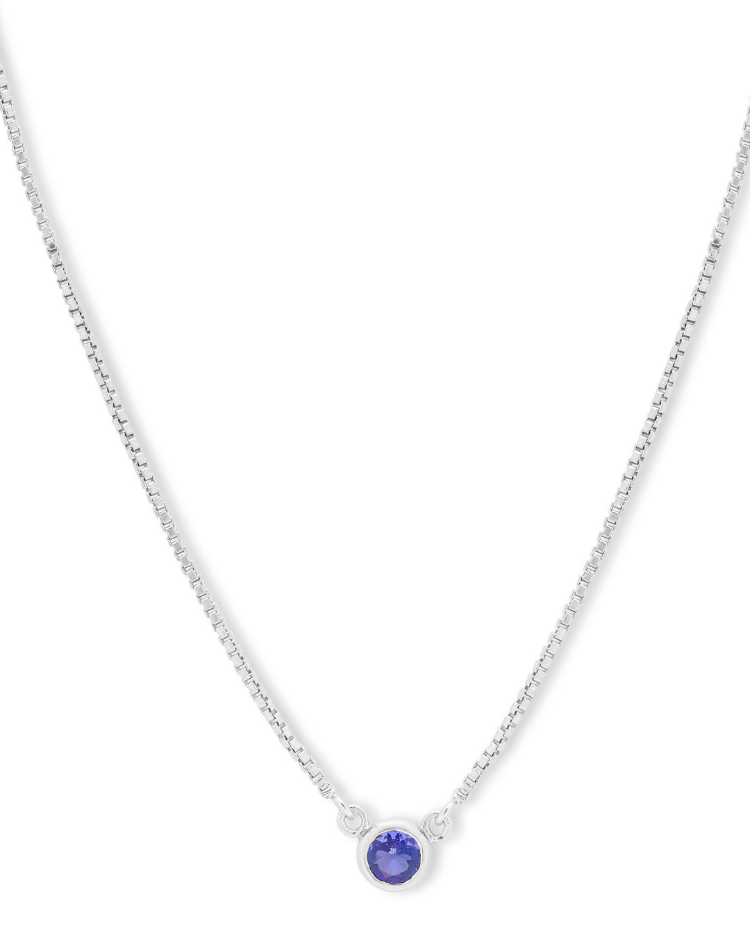 Timeless solitaire pendant with a round-cut gemstone in a prong setting.