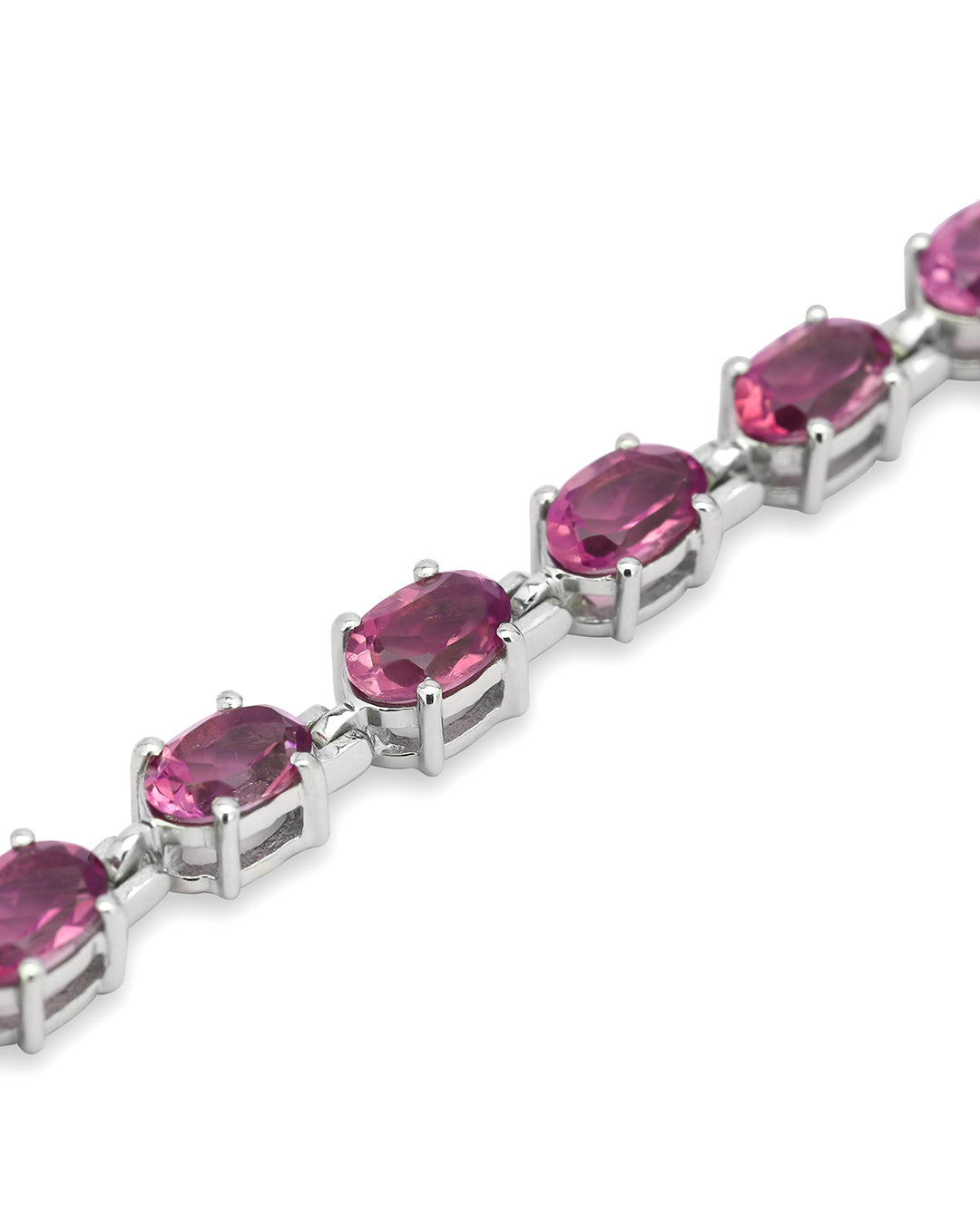 Elegant tennis bracelet with round-cut gemstones in fine metal.