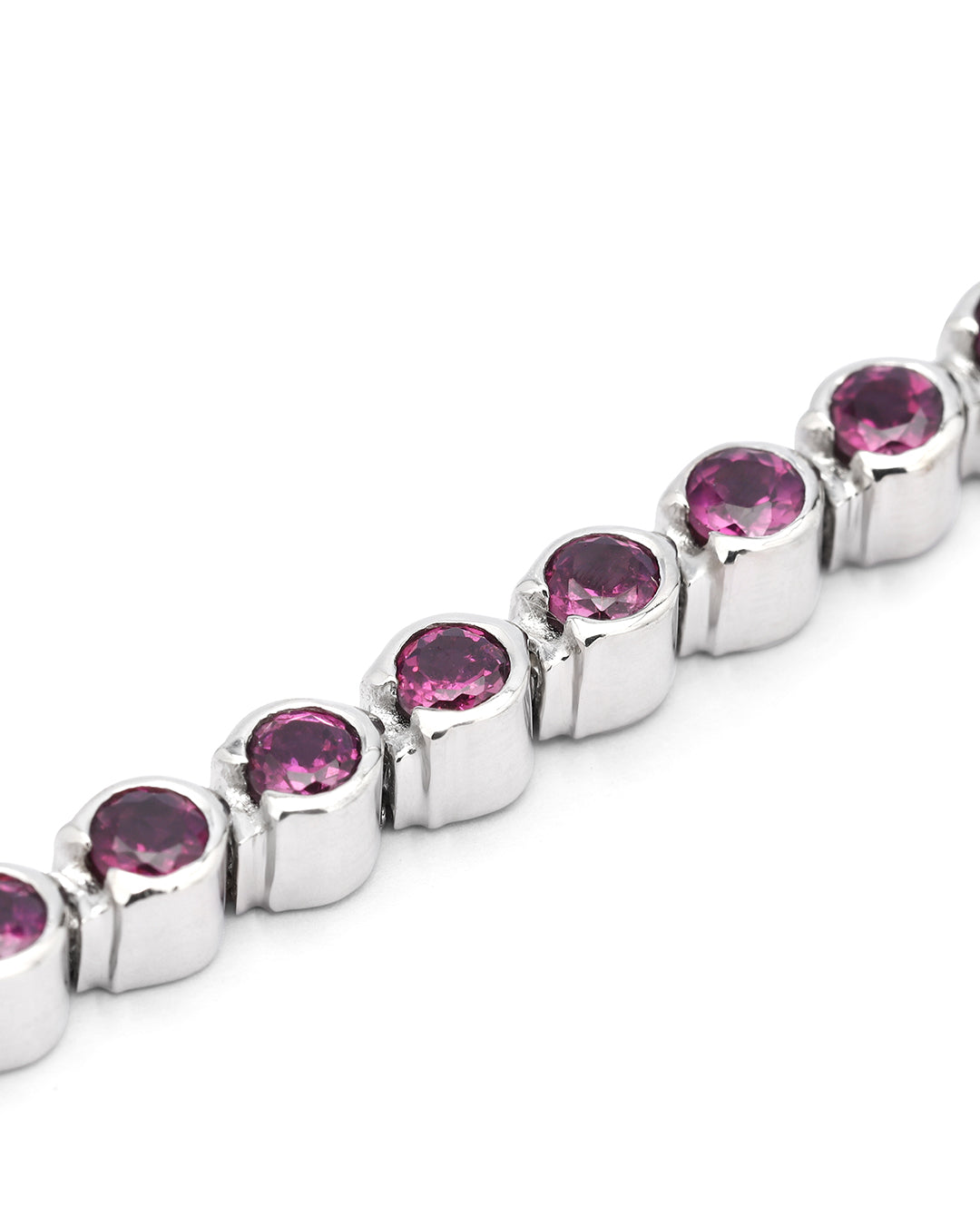 Elegant tennis bracelet with round-cut gemstones in fine metal.