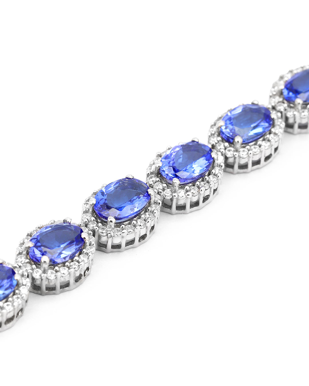 Elegant Halo link bracelet with oval-cut gemstones in fine metal.