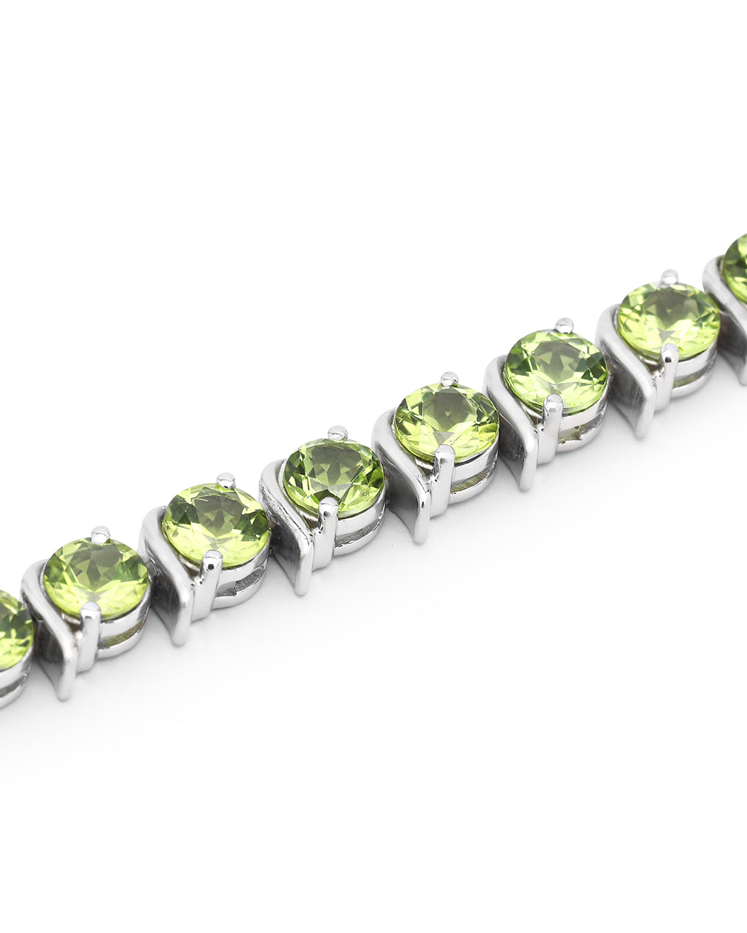 Elegant tennis bracelet with round-cut gemstones in fine metal.