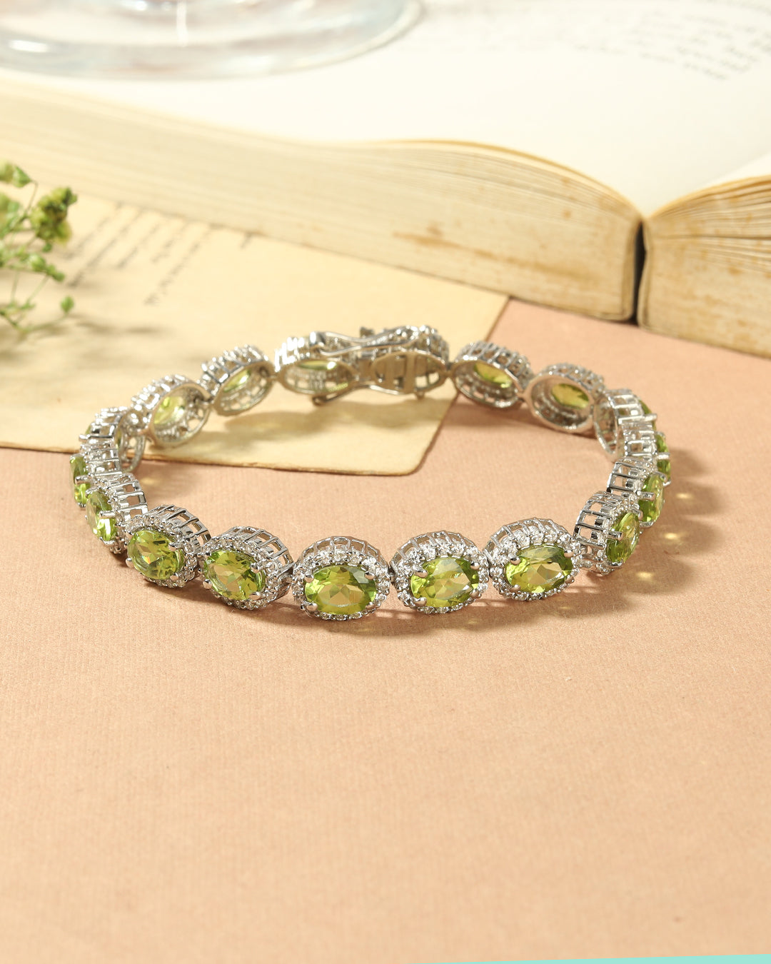 Elegant Halo link bracelet with oval-cut gemstones in fine metal.