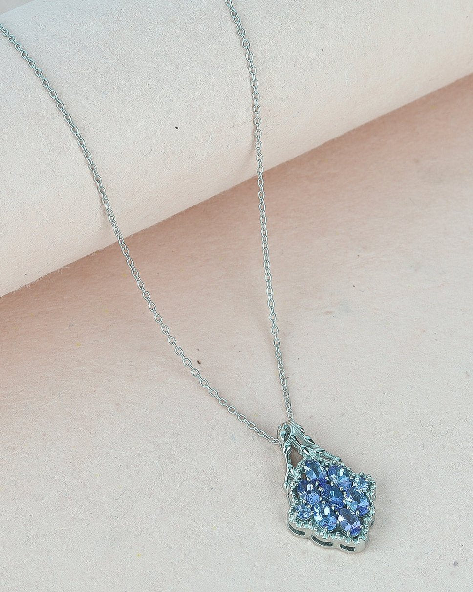 Unique pendant with a oval-cut gemstone in a prong setting.