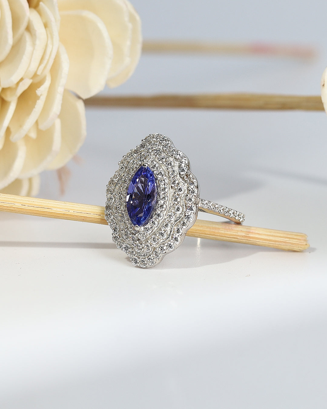 Elegant gemstone ring in sterling silver with intricate detailing.