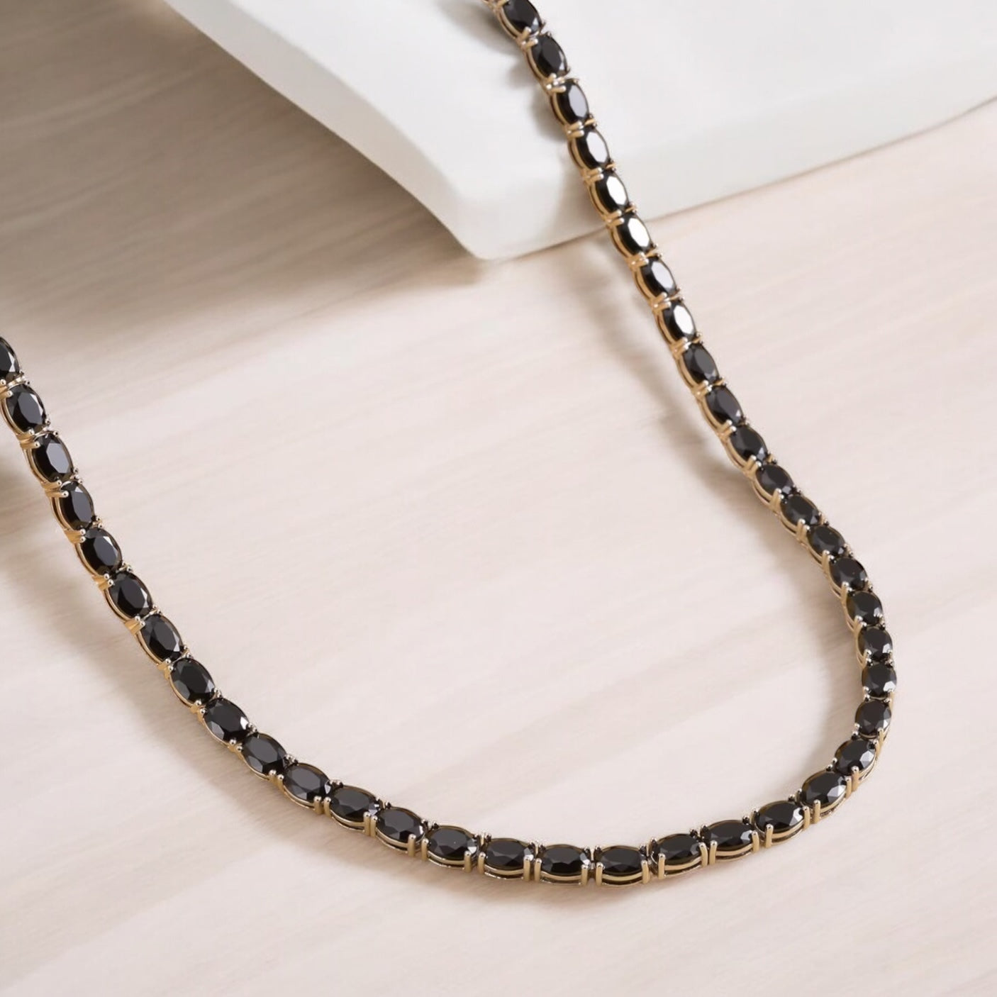 Luxury tennis necklace with sparkling gemstones set in silver.