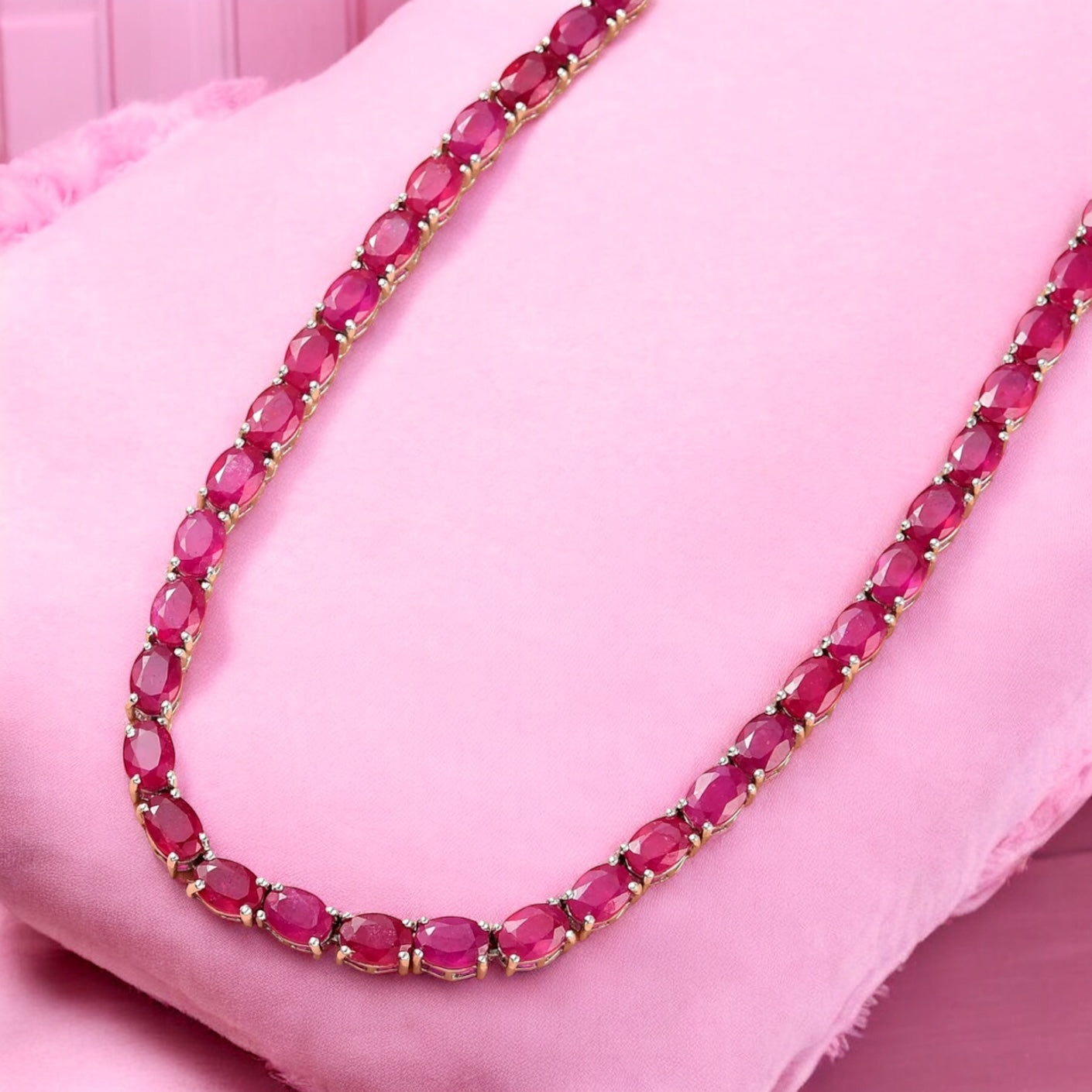 Luxury tennis necklace with sparkling gemstones set in silver.