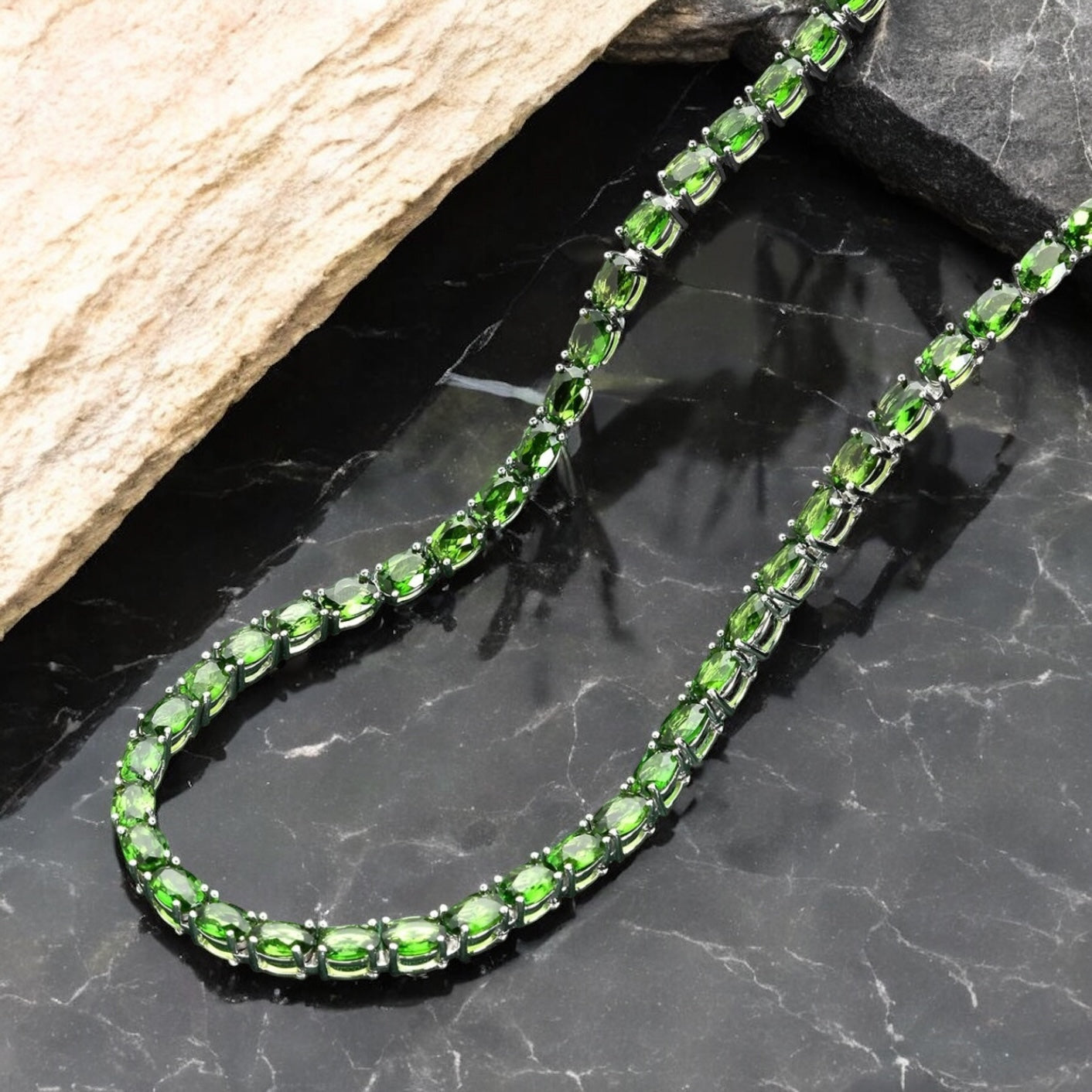 Luxury tennis necklace with sparkling gemstones set in silver.