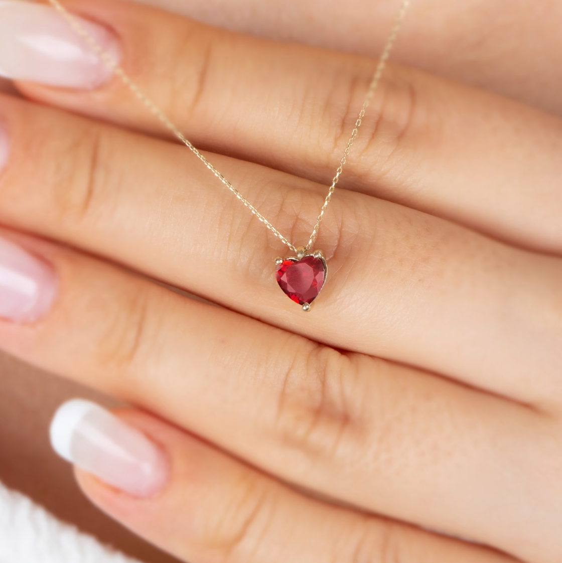 Minimalist gold chain necklace with a delicate pendant.