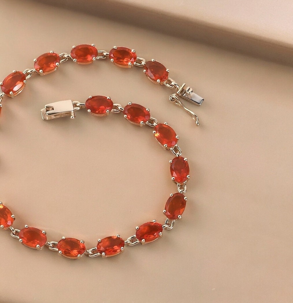 Elegant Fire Opal Tennis Link Bracelet Featuring Oval-Cut Gemstones