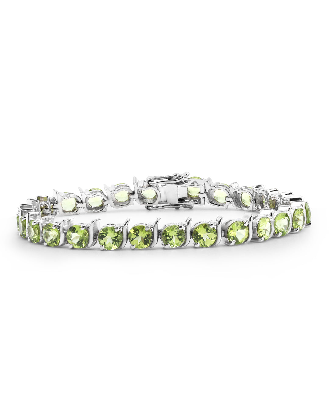  Elegant tennis bracelet with round-cut gemstones in fine metal.