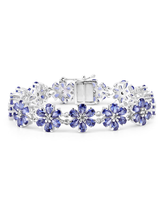 Elegant floral bunch bracelet with pear-cut gemstones in fine metal.