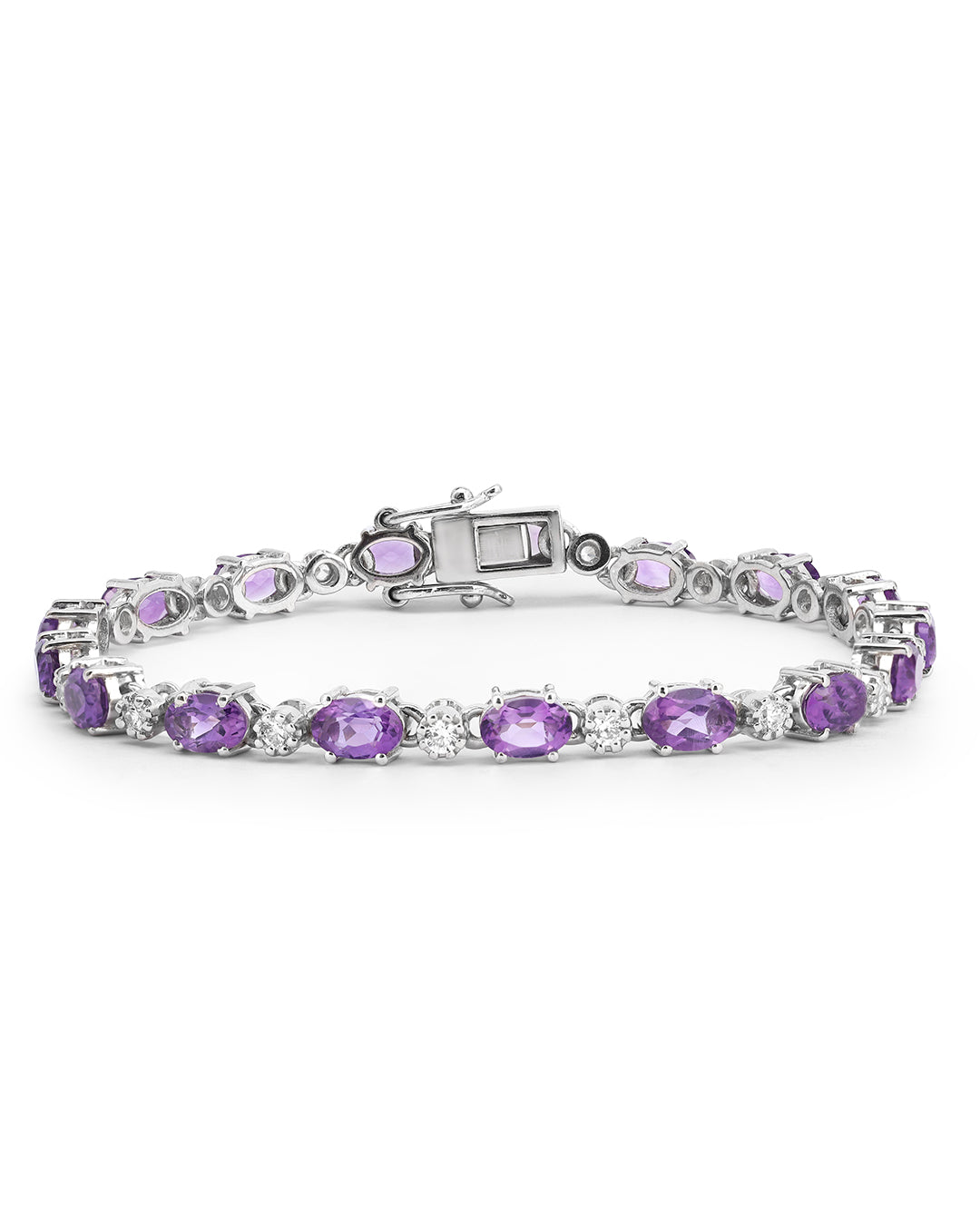 Elegant tennis bracelet with oval-cut gemstones in fine metal.