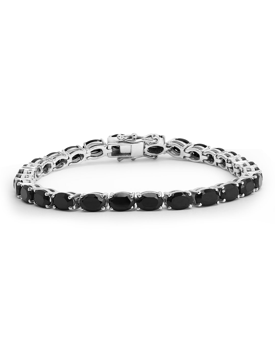 Elegant tennis bracelet with oval-cut gemstones in fine metal.