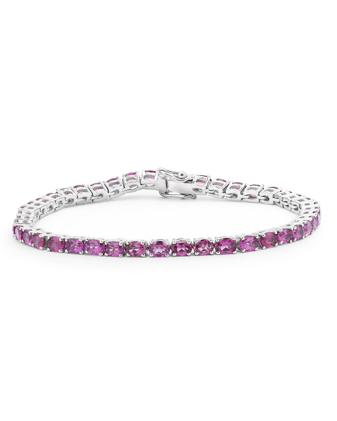 Elegant tennis bracelet with oval-cut gemstones in fine metal.
