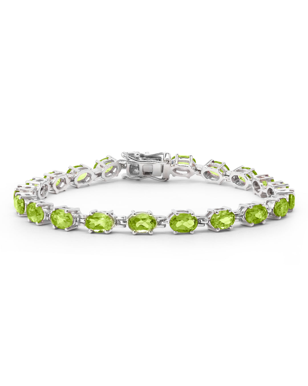 Elegant tennis bracelet with oval-cut gemstones in fine metal.