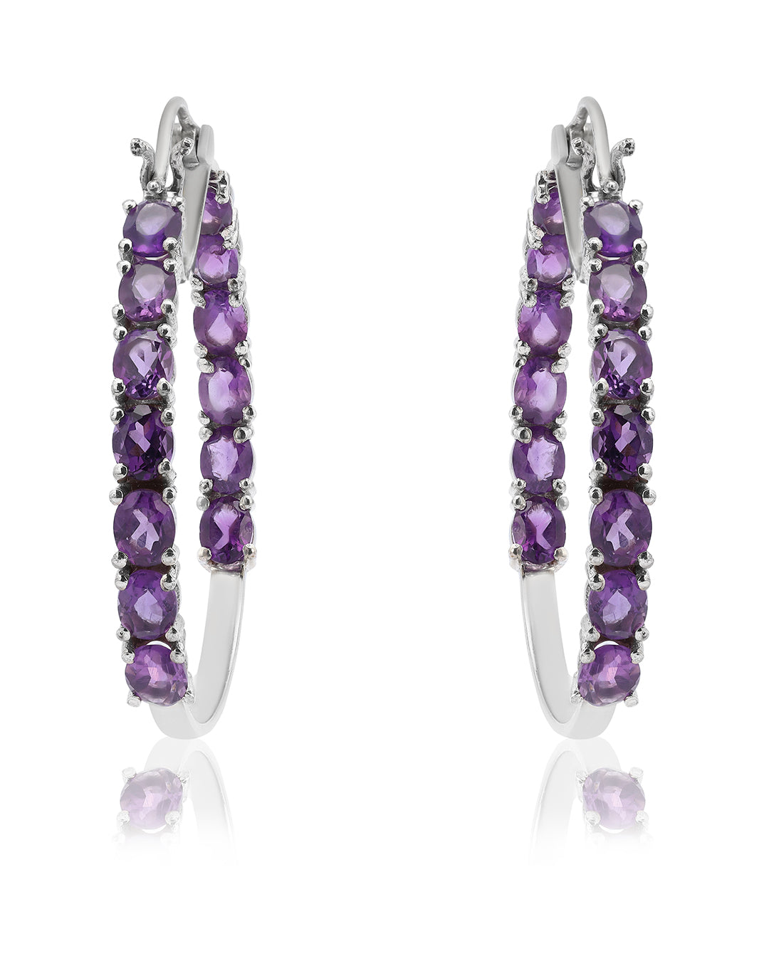 Dazzling hoop earrings featuring precious gemstones in a prong setting.
