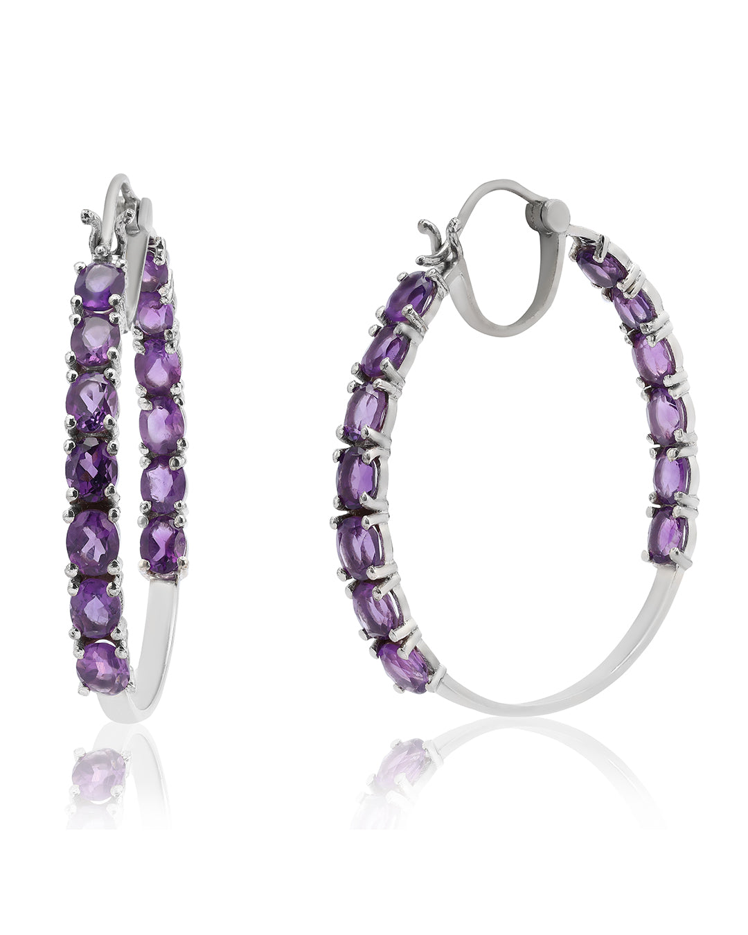 Dazzling hoop earrings featuring precious gemstones in a prong setting.