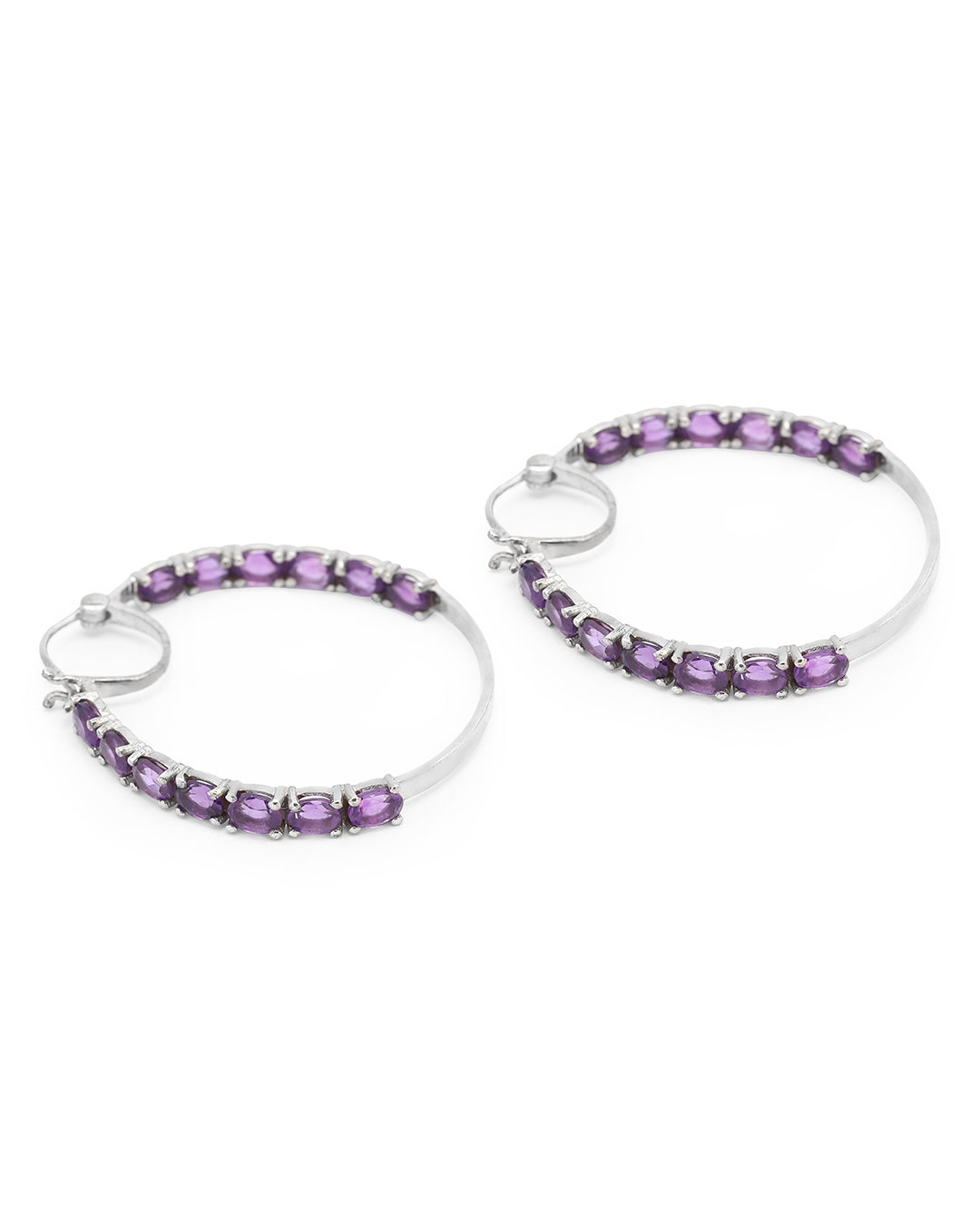 Dazzling hoop earrings featuring precious gemstones in a prong setting.