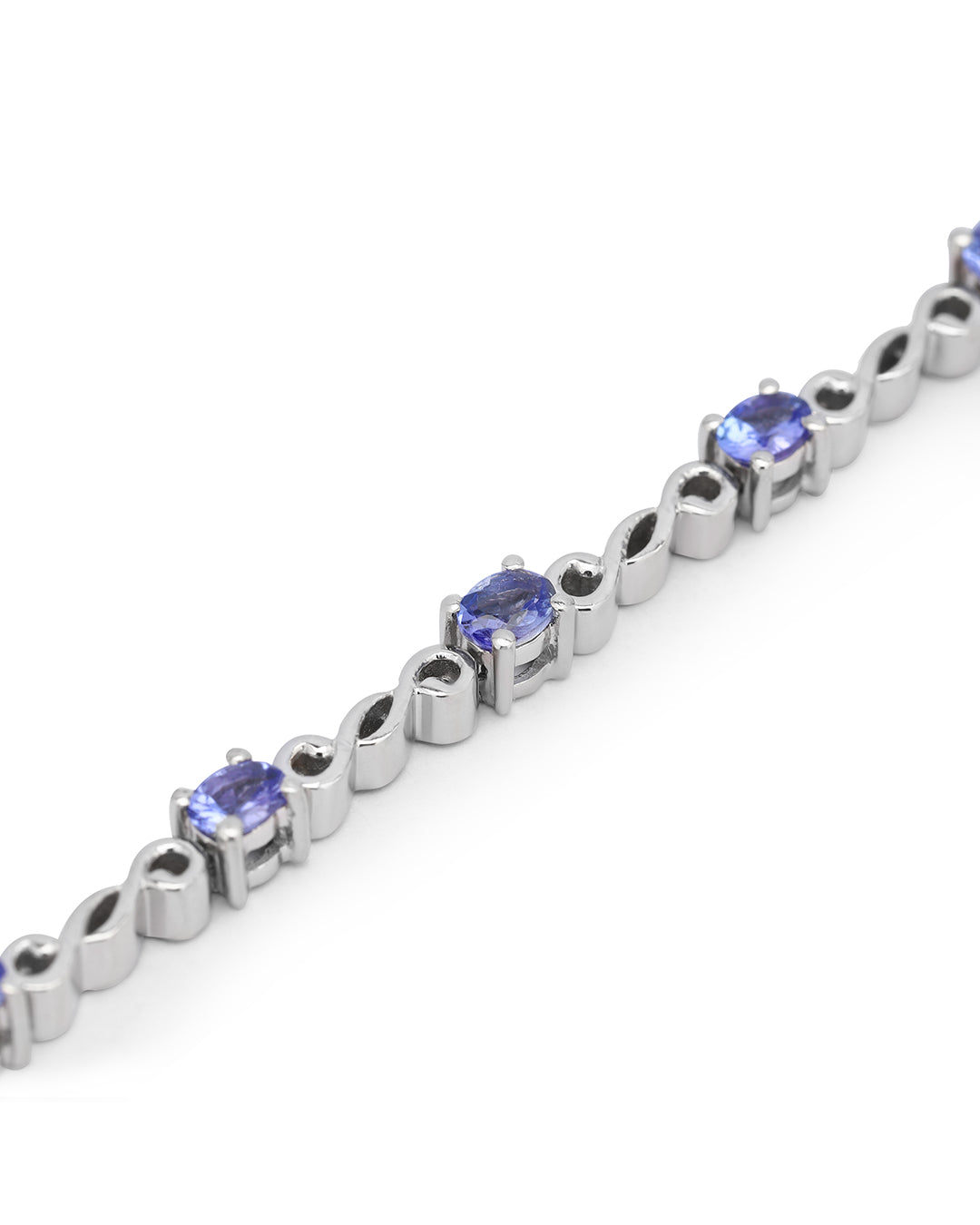 Elegant tennis bracelet with round-cut gemstones in fine metal.