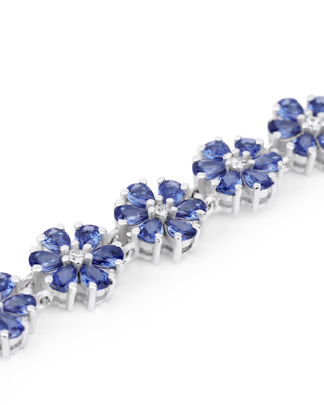 Elegant floral bunch bracelet with pear-cut gemstones in fine metal.