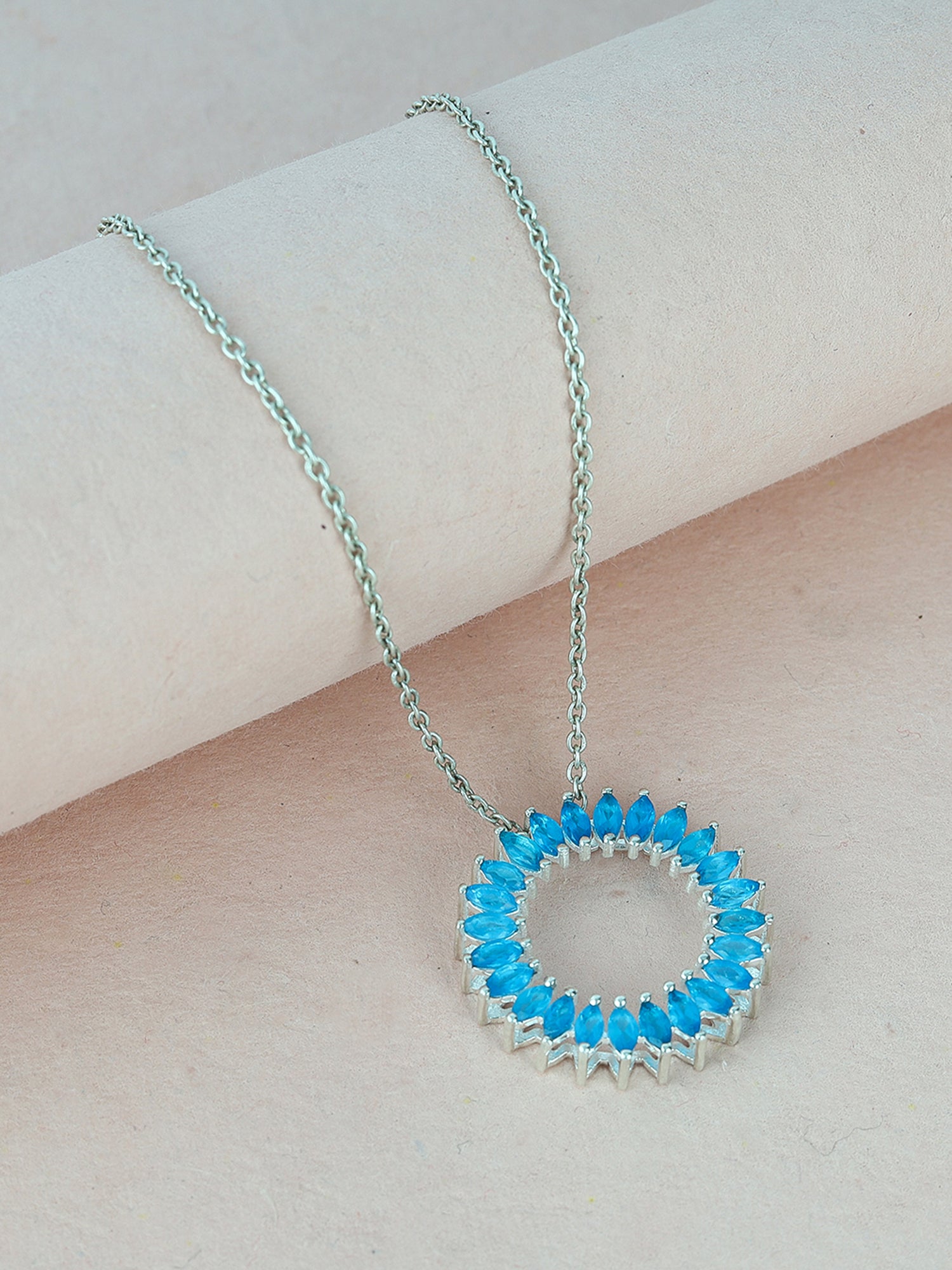 Unique pendant with a Marquise-cut gemstone in a prong setting.