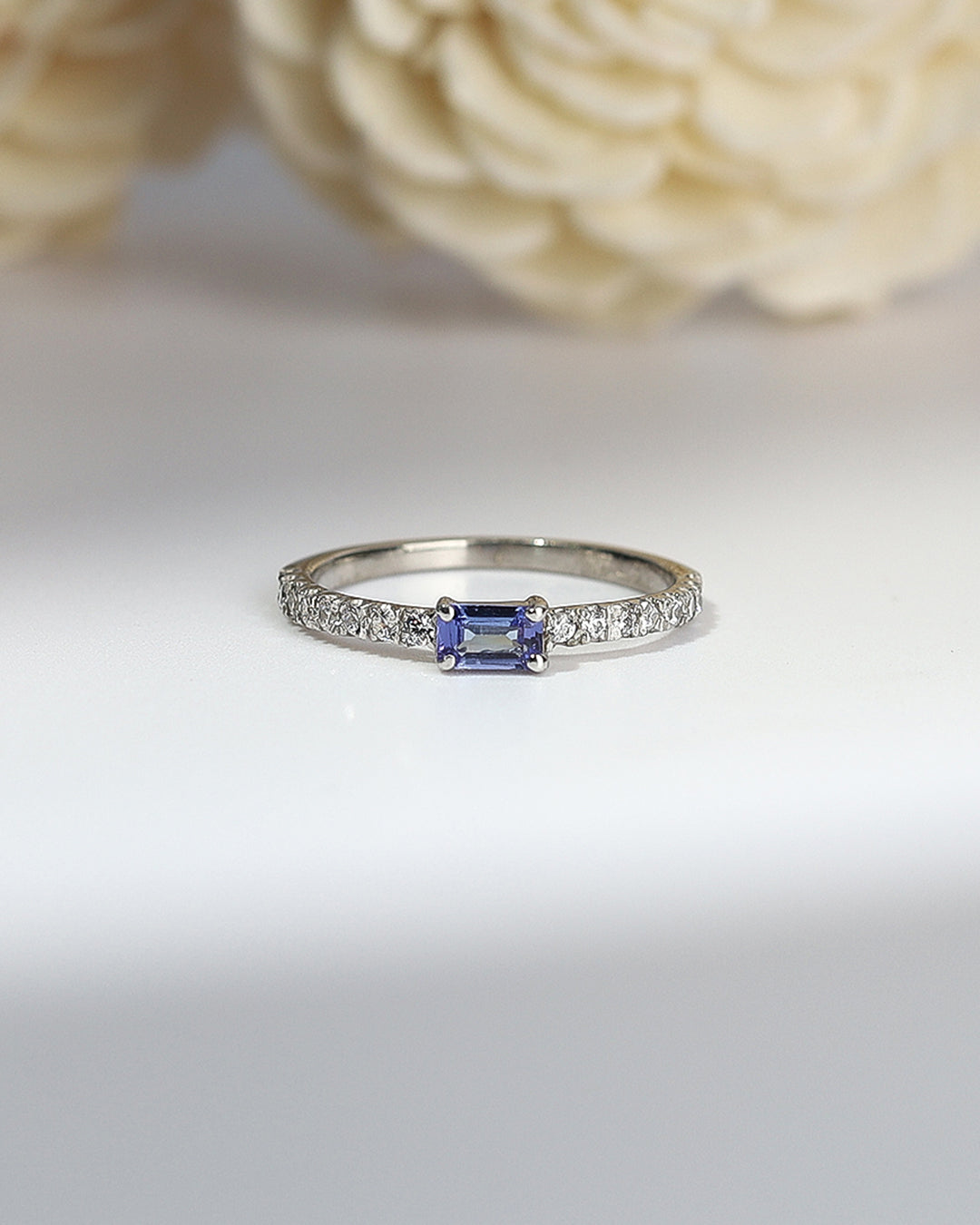 Elegant gemstone ring in sterling silver with intricate detailing.
