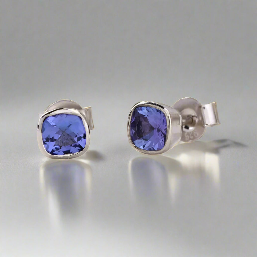 Bezel Set Cushion Tanzanite Solitaire Stud Earrings, A Timeless Jewelry Piece