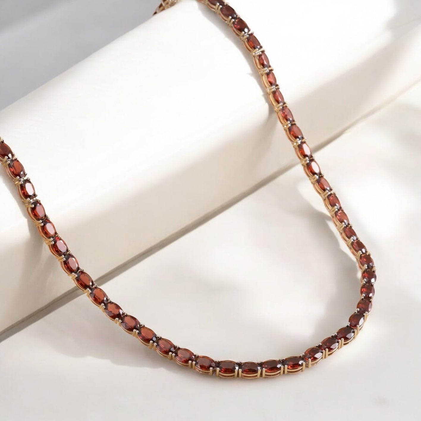 Luxury tennis necklace with sparkling gemstones set in silver.