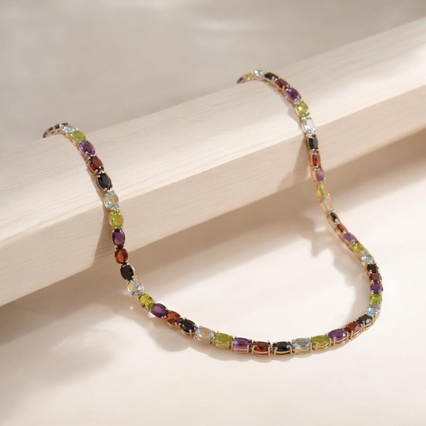 Luxury tennis necklace with sparkling gemstones set in silver.