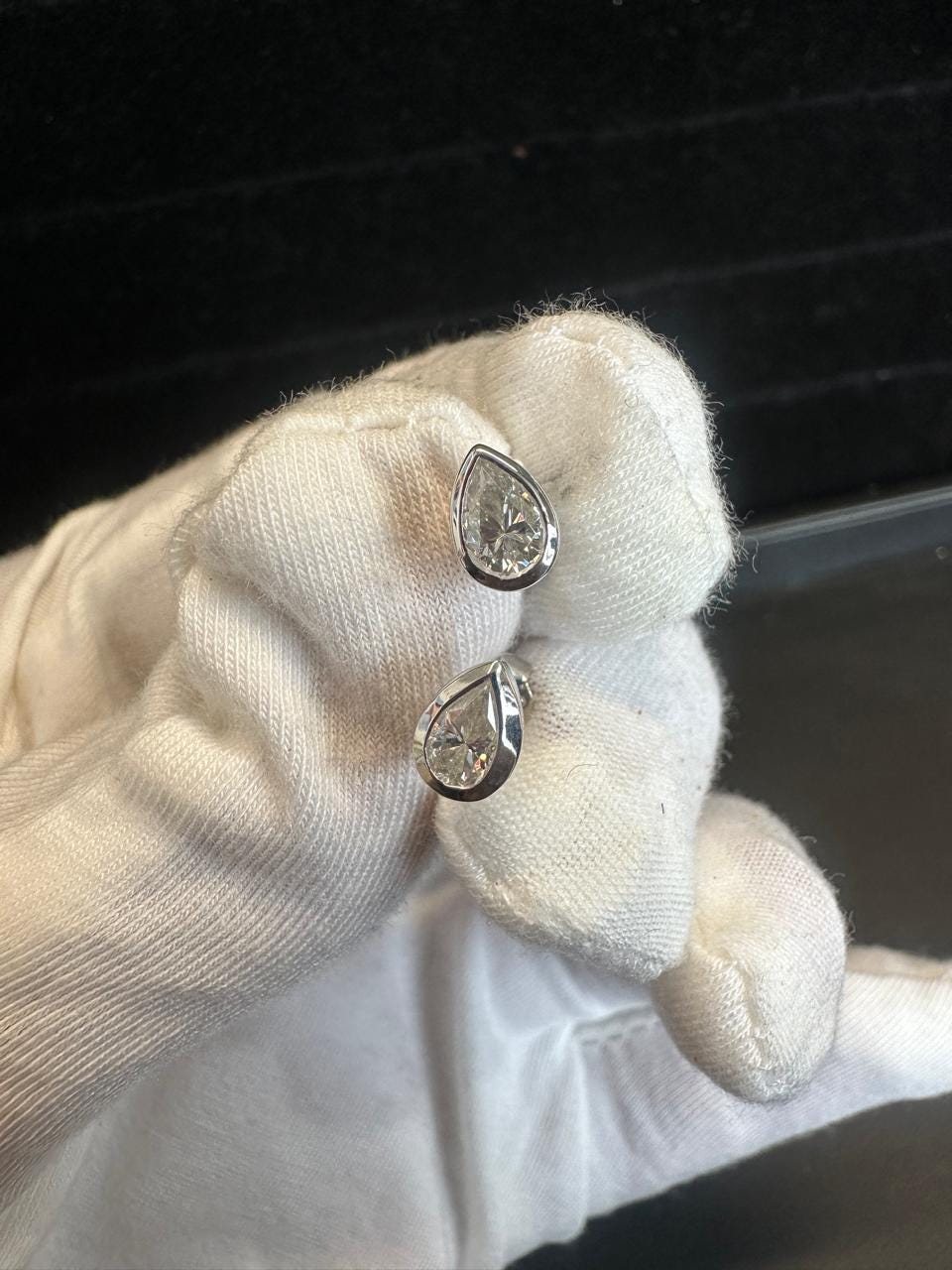 Pear Cut Moissanite Stud Earrings | Platinum Sterling Silver Bezel Set