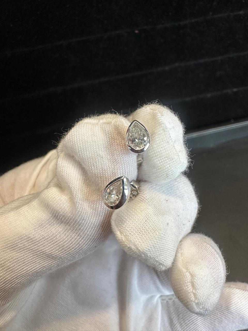 Pear Cut Moissanite Stud Earrings | Platinum Sterling Silver Bezel Set